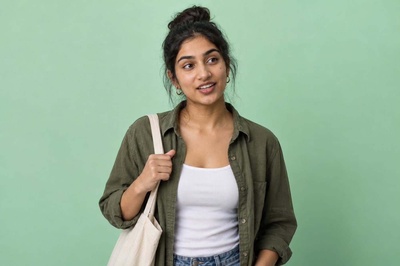 Example seller, a woman in an olive shirt with a tote bag.