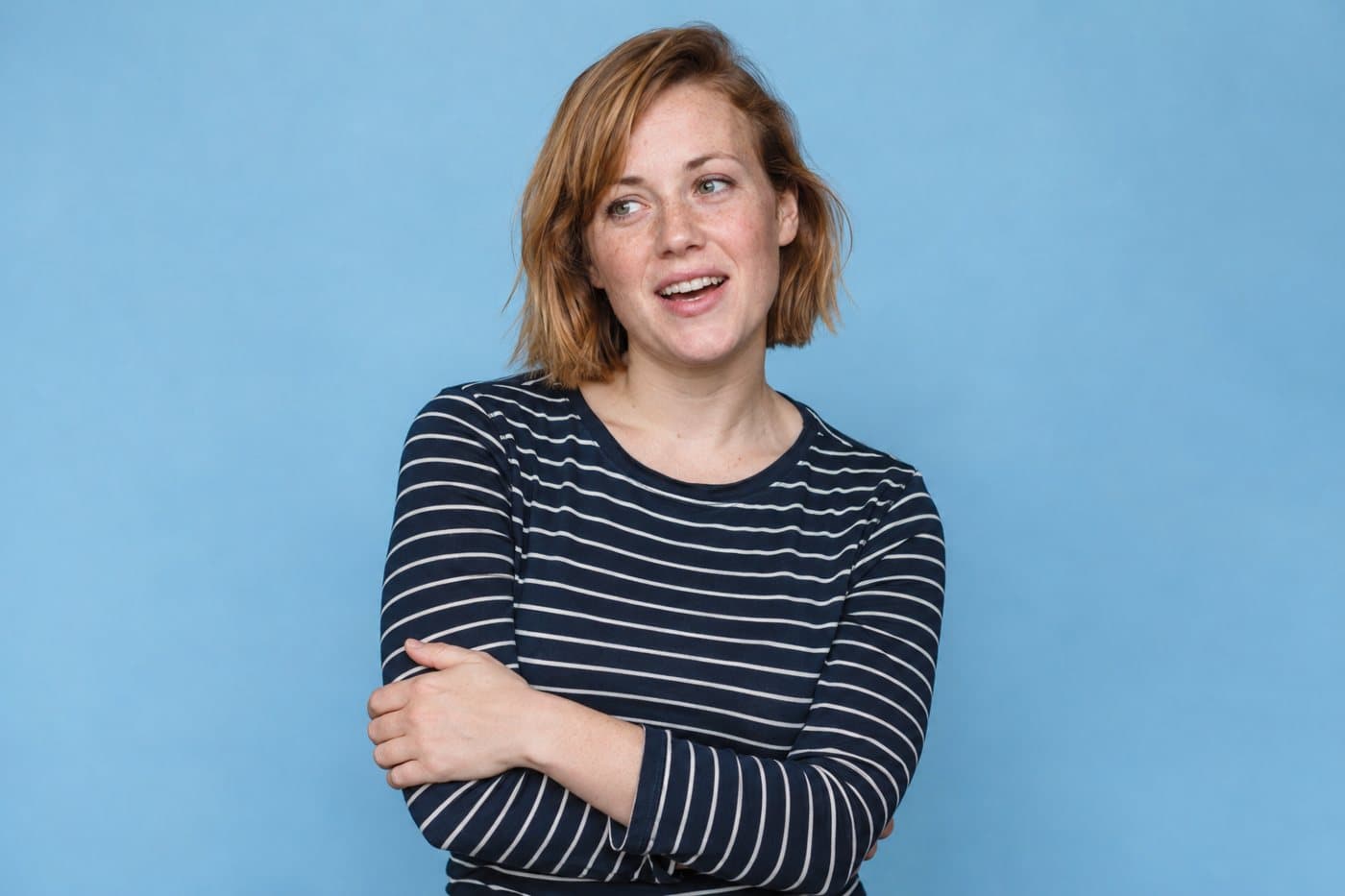 Example person, a woman in a striped top.
