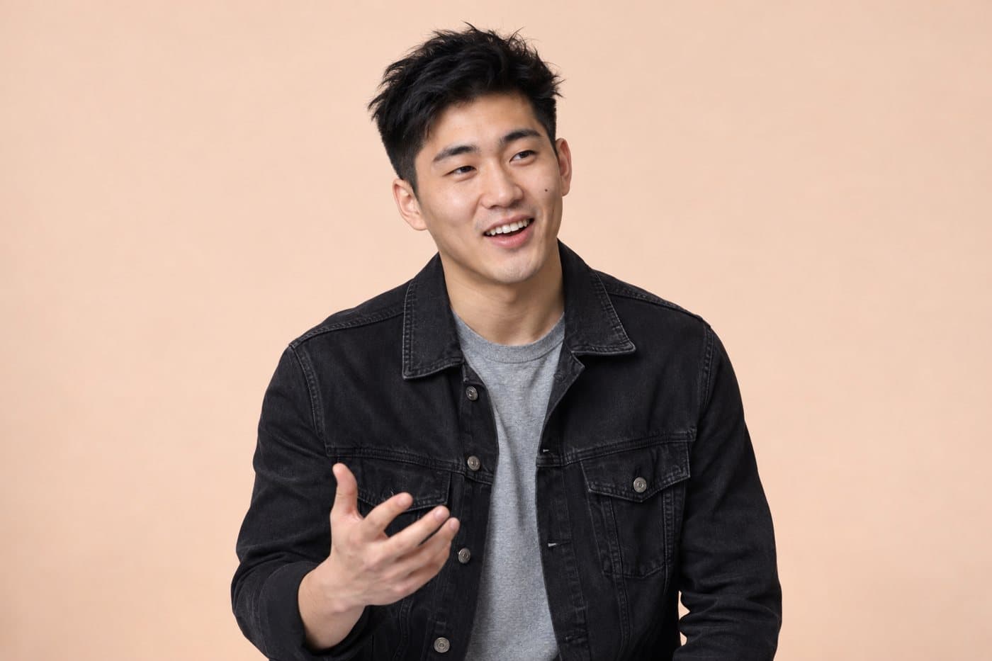 Example person, a man in a black denim jacket.